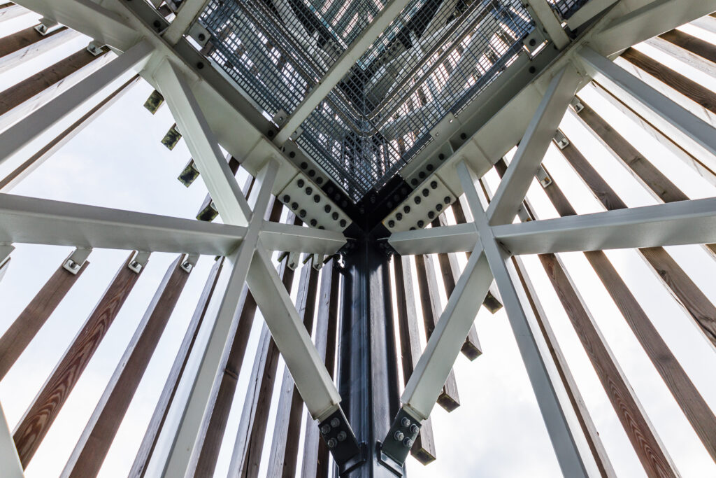 Massive industrial steel construction end-to-end with bolts and nuts on the construction