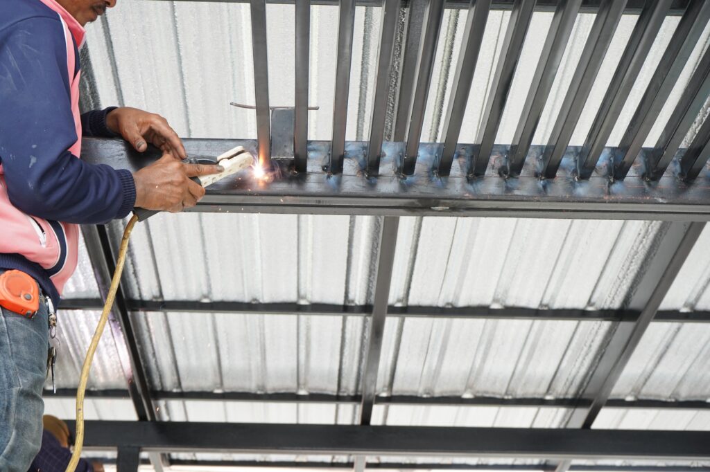 welders-are-welding-steel-roof-frame-home
